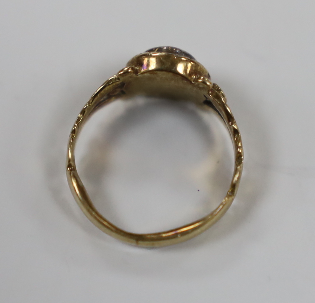 An early 19th century yellow metal and collet set rose cut diamond ring, with carved shoulders, size F, gross weight 2.4 grams.